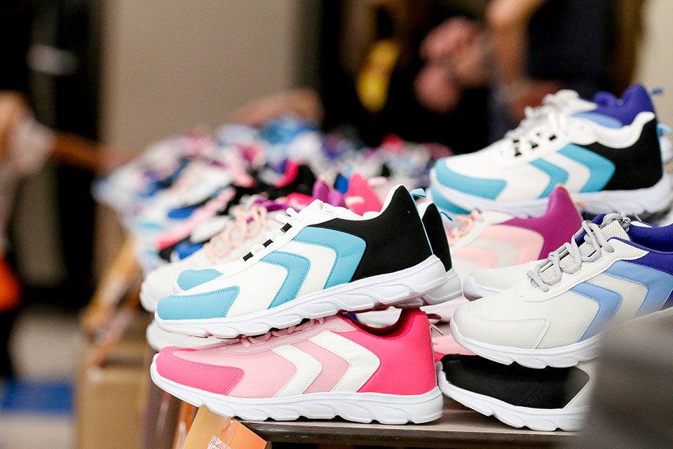 A pile of colorful kids shoes